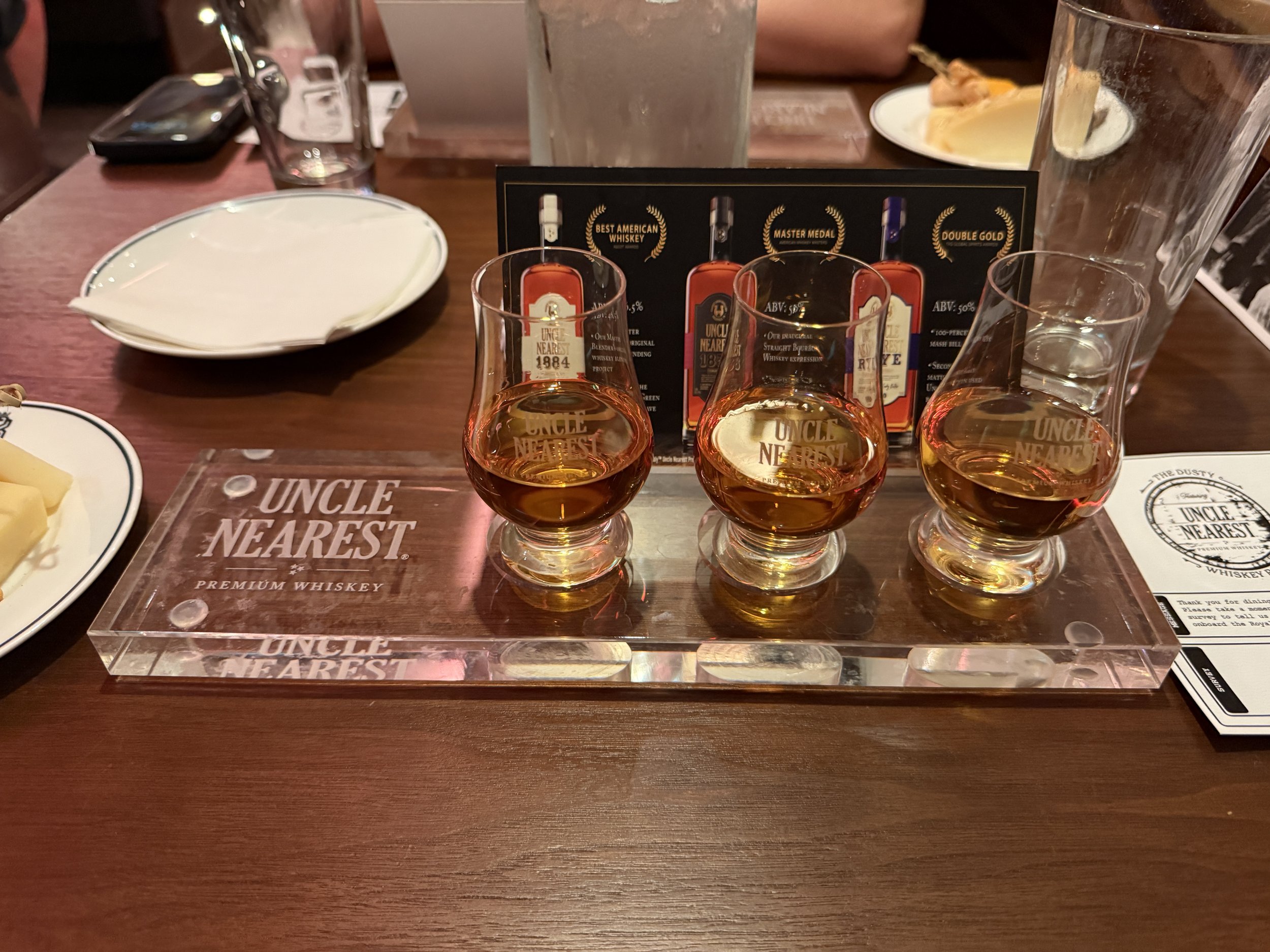 Uncle Nearest whiskey tasting flight with award-winning bottles displayed
