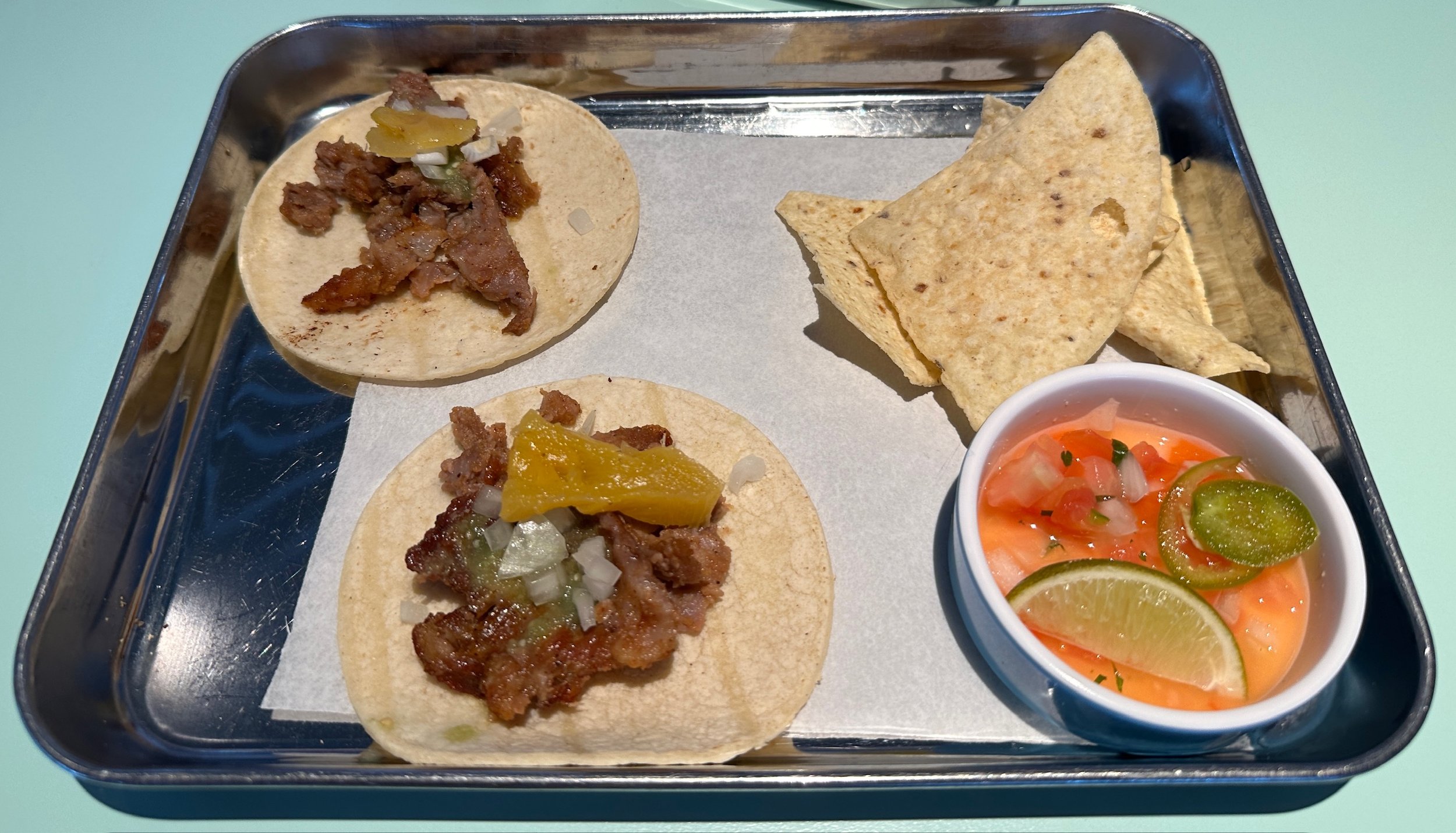 Beef tacos with tortilla chips and pico de gallo salsa