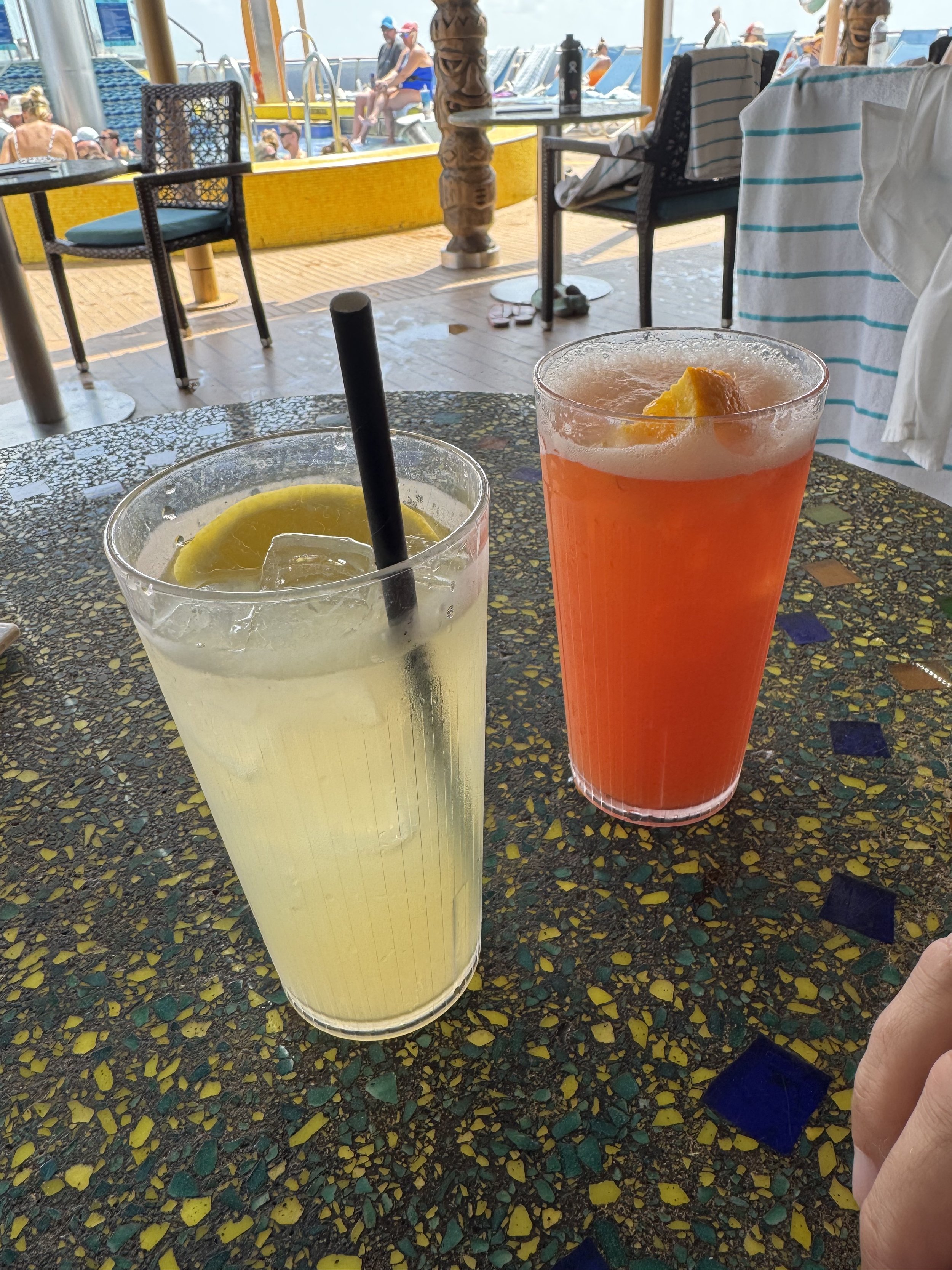 Two refreshing cocktails on cruise ship deck with ocean view