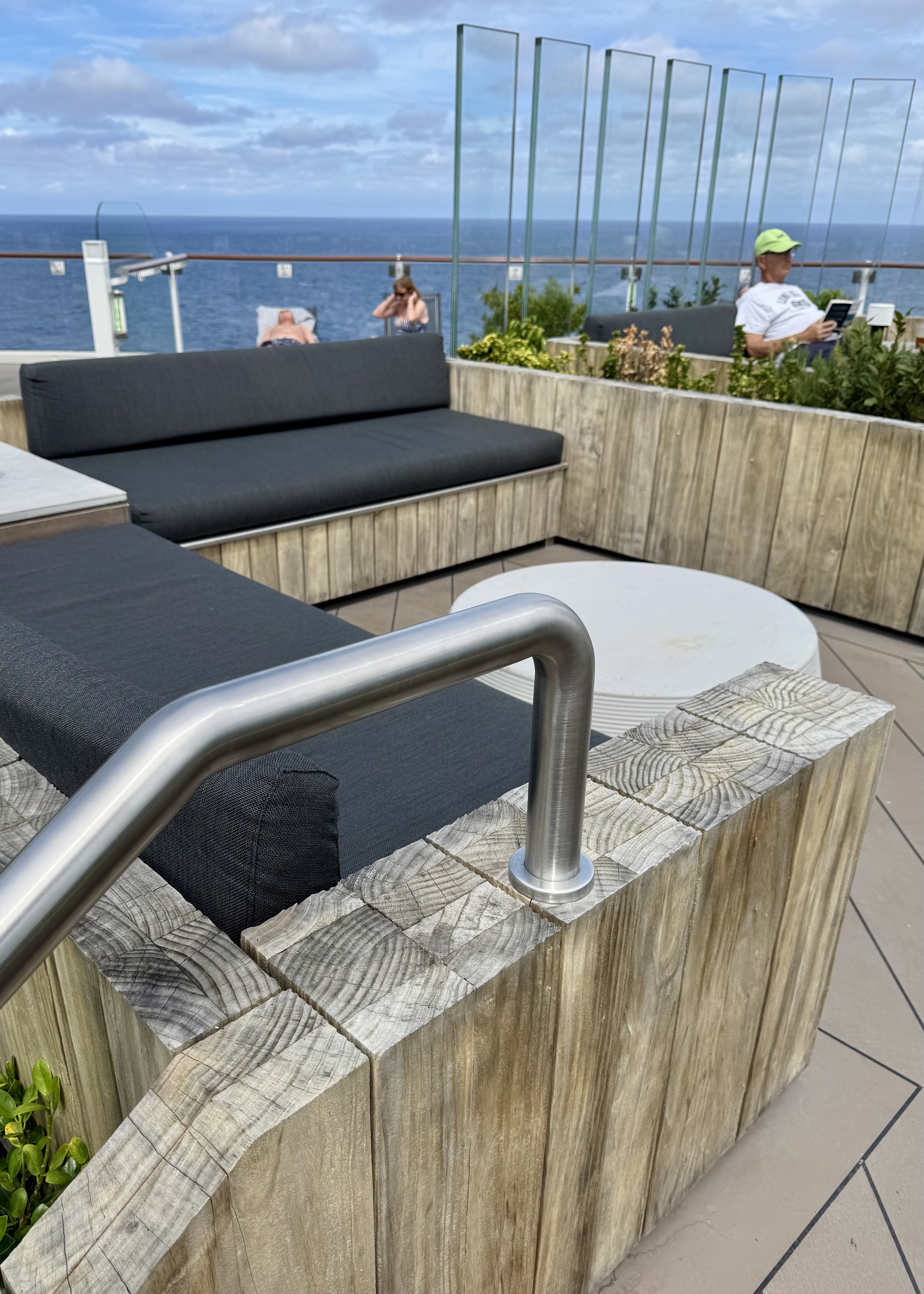 Modern ship deck lounge area with ocean views
