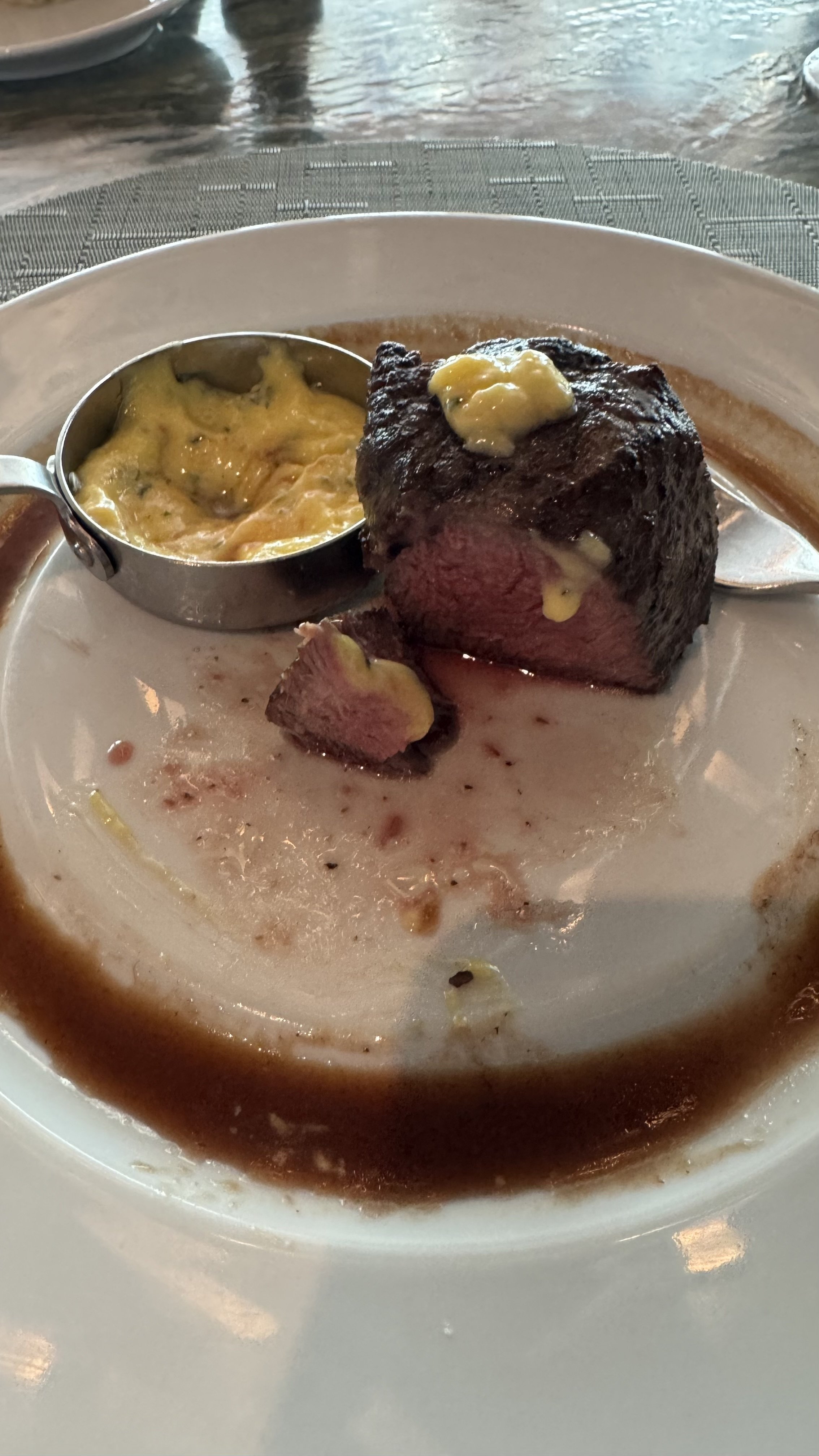 Filet mignon steak with compound butter and bearnaise sauce