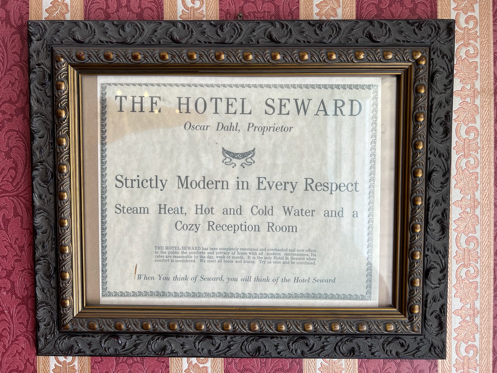 Historic Hotel Seward advertisement framed ornate black gold border
