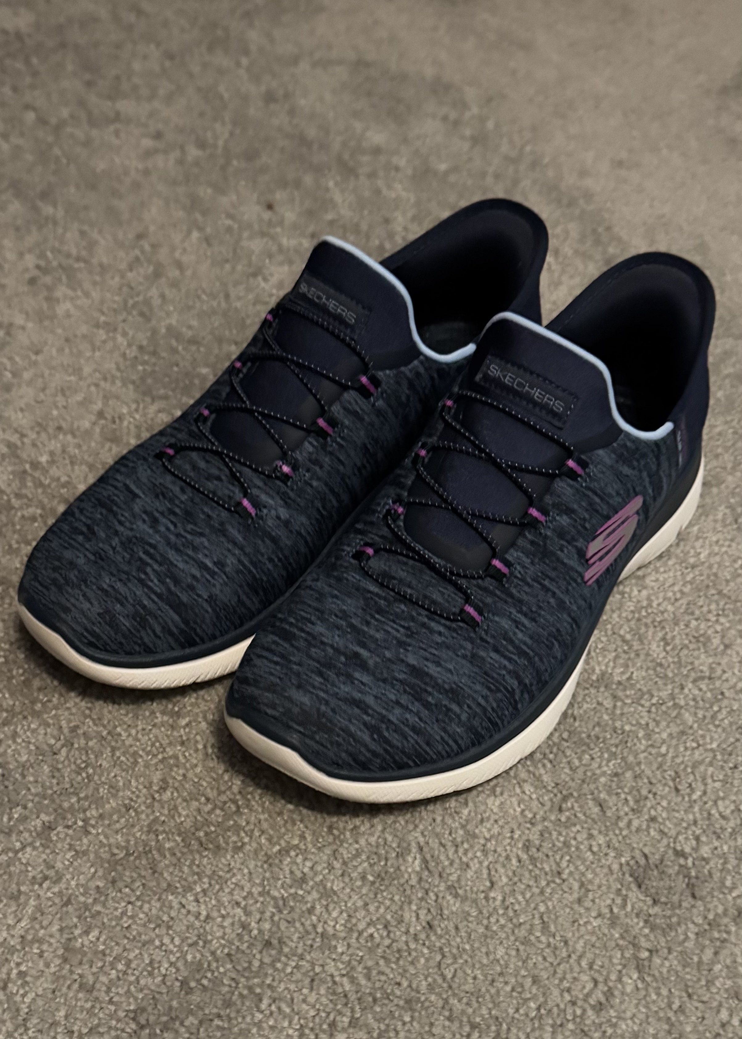 Skechers black slip-on sneakers with purple accents and white sole